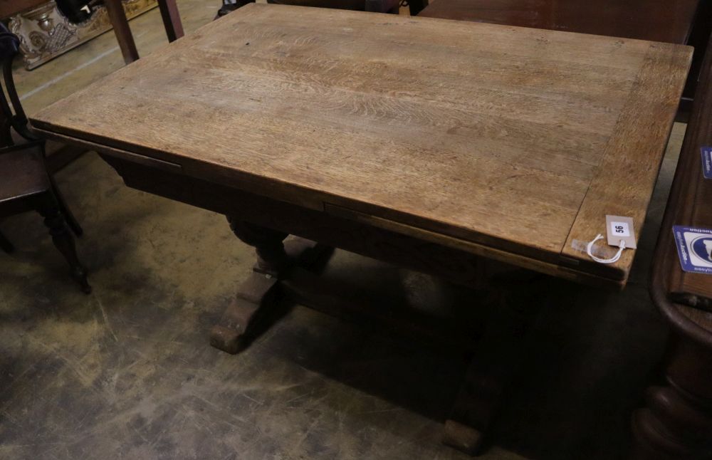 An Elizabethan style oak draw leaf extending dining table, 210cm extended width 80cm height 75cm